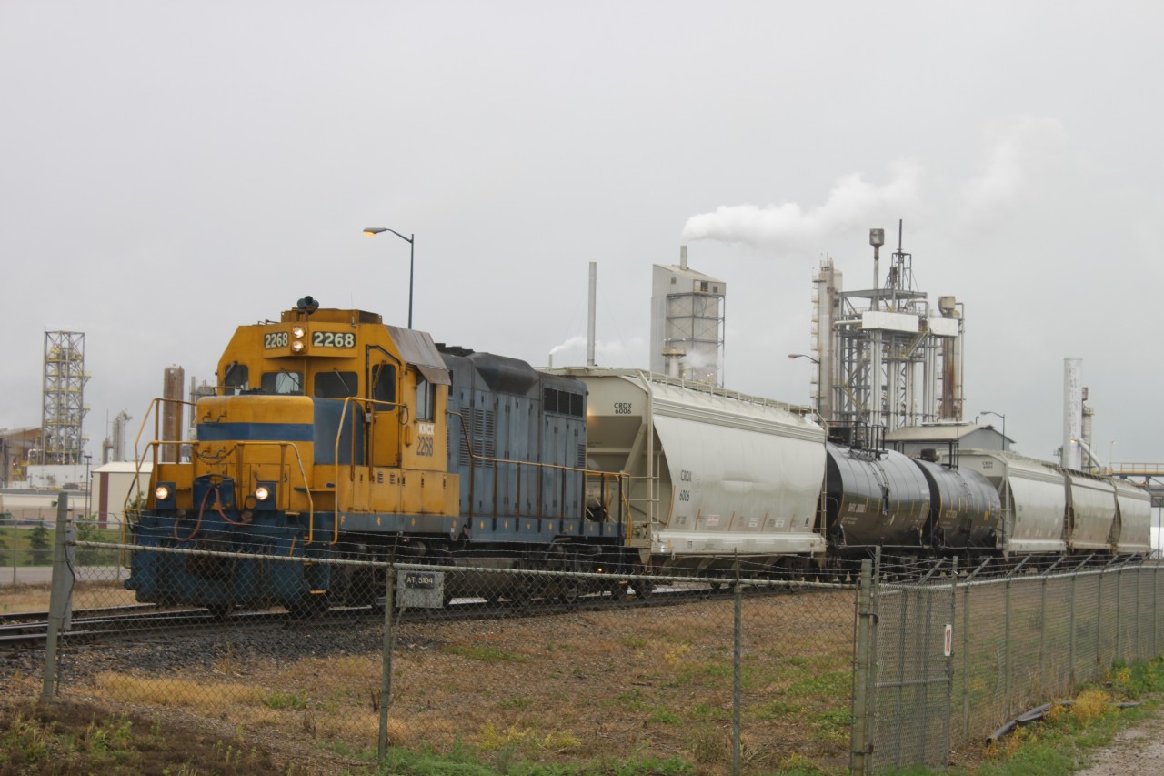 KNCX 2268, the "Koch Switcher" switches some cars at the Koch Fertilizer Plant. It appears to be an ex-Santa Fe GP9u. If that's the case this unit could have been pulling trains over the Cajon Pass or just switching cars in San Bernardino back in its day.