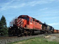 CP SD40-2 5749 along with CSXT ES44DC 5201, lean into the curve through Innerkip, enroute to the crew change point of London, Ontario.