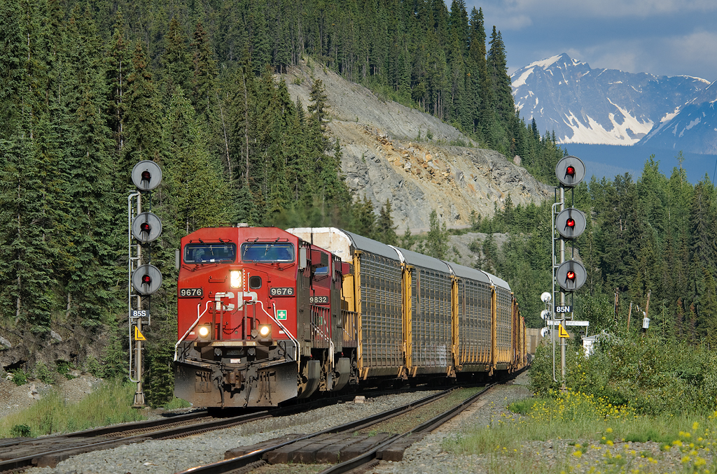 Detouring due to washouts on CP's Laggan Subdivsion, CP Train 100-20 (running as CN train F40251 20 between Coho, BC and East Edmonton, AB) crosses down to the south track of the CN Albreda Sub at Geikie.