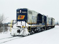 A day at a southwestern Ontario hotspot postponed. A day at Denfield Sideroad cut short, a drive was in order. Rumors abounded about the arrival of an F unit on the Goderich-Exeter. Once these lines were a staple of such units, being in the snow belt. So avoid CN, CP, and Via for the day. Luck would be on our side, first place we stop, we hear 567's. RLK 4001 was well known, as the power came into sight. A cowl carbody. A day full of mainline can't beat this. Ironically, I saw the F in North Bay before it was shopped by Ontario Northland. It went west, came to Goderich-Exeter. Now her and her sister, are in Salford, less than 15 minutes away from my home, awaiting their rebuild at their new home.