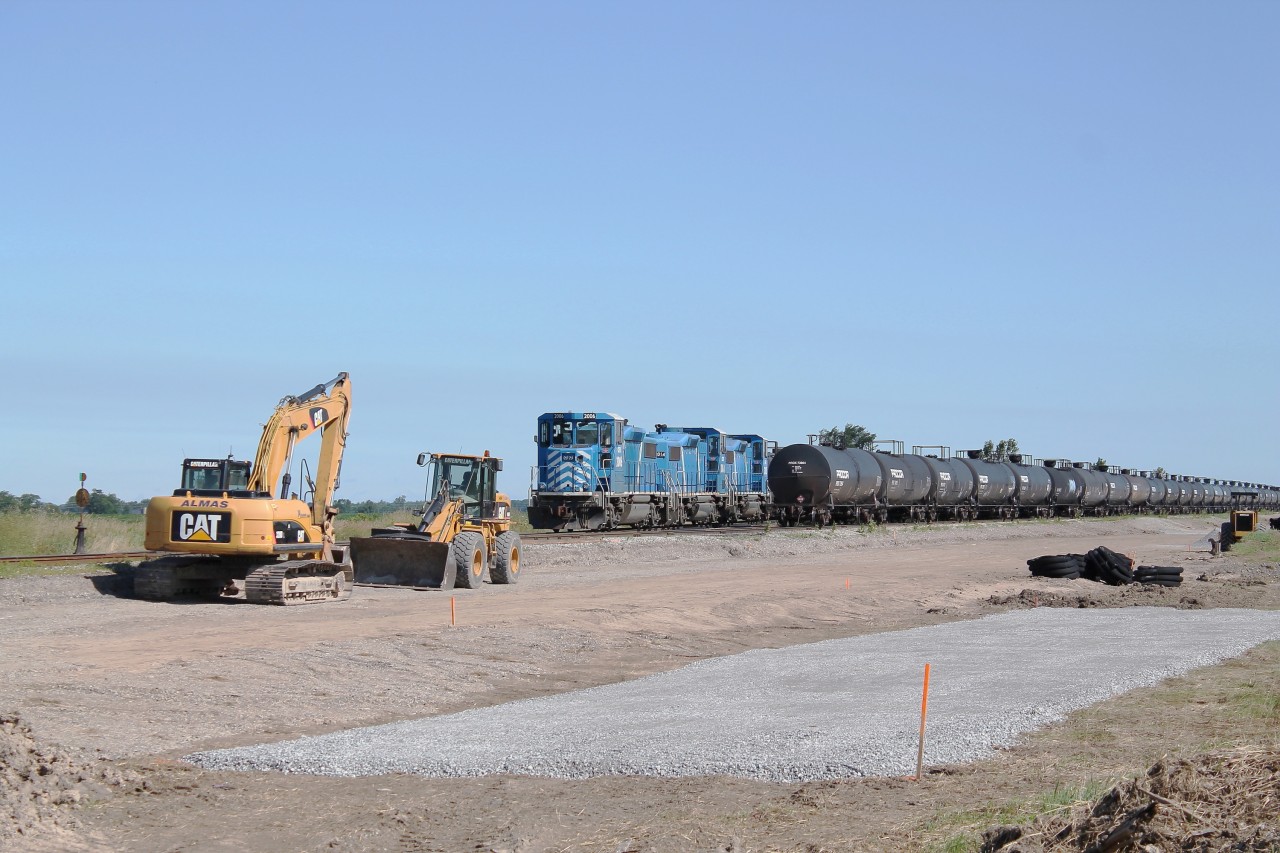 The Nanticoke Road Switcher sits idle in the SOR's Garnet yard awaiting its crew to come on duty.  In the foreground of this image are many earth moving machines that have been doing a lot of work alongside the yard.  It is unclear right now what will be going here but one this is for sure the landscape around Garnet it changing.  Click here to see what Garnet looked like in November before this construction started: