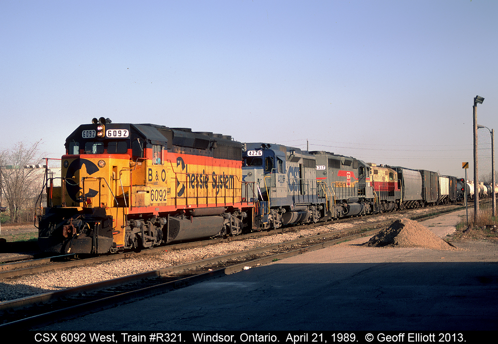 Another colorful lashup on R321 today.  Ex-Chessie GP40-2 #6092 leads the consist with an old soldier GP30 #4226(ex-C&O), a Family Lines SD40 #8317, and Cape Cod & Hyannis GP9 #24, which is hitching a ride to new owner Mid-Michigan Railroad.  Hard to beat R321 for great consists back in the late 80's early 90's.