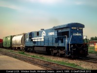"Hammerhead".....  Conrail 6590, a C30-7, runs long hood forward as it leads train #LV20 into Windsor, Ontario having come from Livernois yard in Detroit, Michigan.  LV20 was a late in the day transfer from Conrail to the CP in Windsor.  Later the train was moved to River Rouge yard and was renamed RR20.  Unusual power such as C&NW GP50's, Oakway SD50's, BN C30-7's, UP/MP SD40-2's were only some of what I saw over the time I was hanging around the area.