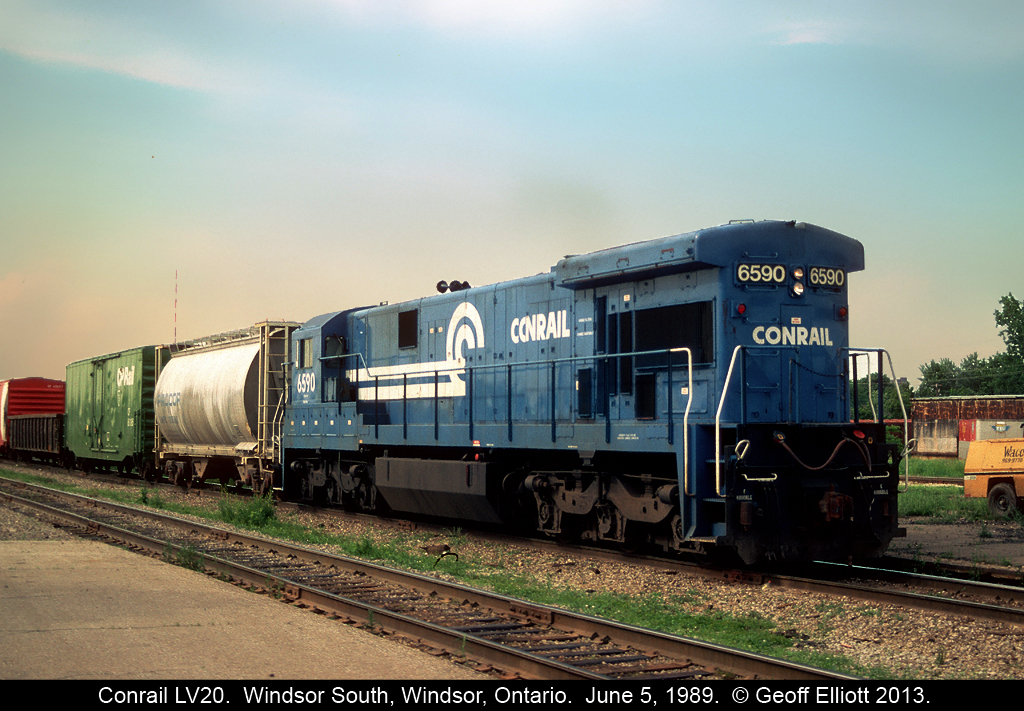 "Hammerhead".....  Conrail 6590, a C30-7, runs long hood forward as it leads train #LV20 into Windsor, Ontario having come from Livernois yard in Detroit, Michigan.  LV20 was a late in the day transfer from Conrail to the CP in Windsor.  Later the train was moved to River Rouge yard and was renamed RR20.  Unusual power such as C&NW GP50's, Oakway SD50's, BN C30-7's, UP/MP SD40-2's were only some of what I saw over the time I was hanging around the area.
