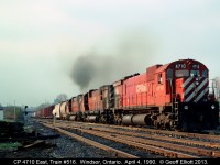 Three "Big M's", all M636's, crest the hill with Train #516 in April of 1990.  The Big M's never seemed to have any problems pulling tonnage up and out of the Detroit River Tunnel, and today is no exception.  Miss the sounds of these working hard up the hill!!