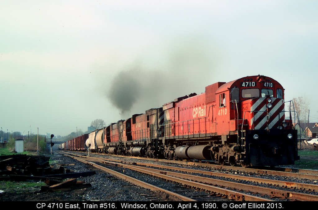 Three "Big M's", all M636's, crest the hill with Train #516 in April of 1990.  The Big M's never seemed to have any problems pulling tonnage up and out of the Detroit River Tunnel, and today is no exception.  Miss the sounds of these working hard up the hill!!