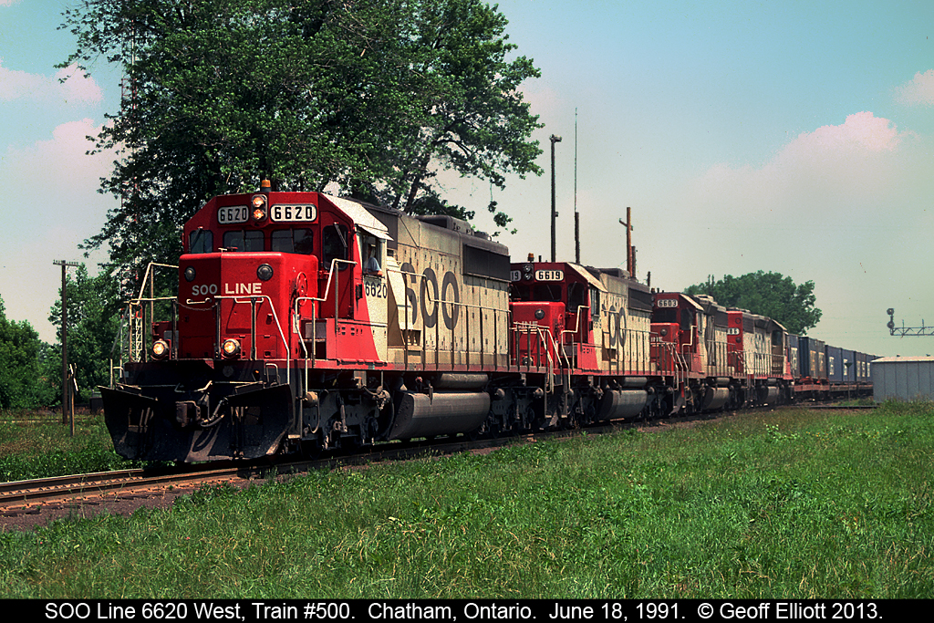 SOO Line 6620 leads a quartet of white SD40-2's on Train #500 as it bangs the CSX diamond in Chatham, Ontario while en-route to Chicago back in 1991.  With the sale of the remaining SOO units pending, albeit SD60's, it's nice to find gems like this in my collection.
