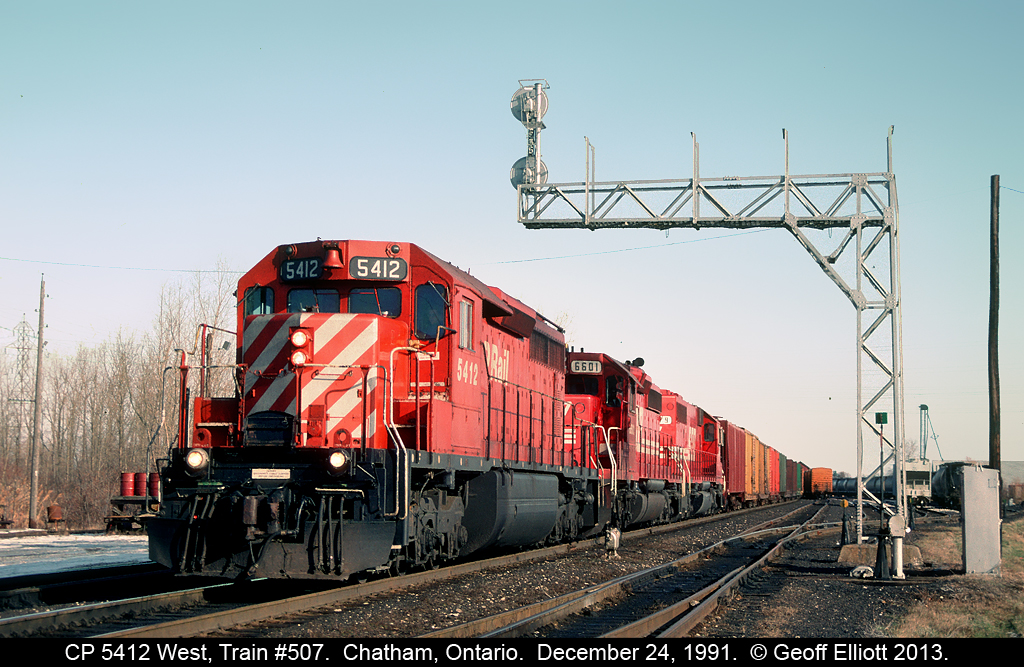 CP 5412, an ex-QNS&L SD40-2, leads two SOO units under the westbound signal bridge in Chatham Yard.  Although it's Christmas Eve, you'd never know it by the lack of any snow accumulation on the ground!!