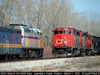 VIA #74, with 6455 leading, meets CN 9633, train #381, at Jeanette's Creek.  There is something to be said for double track when you have both freight and passenger service running on the same subdivision, however in CN's wisdom, the eastbound main has already been removed requiring that meets like this took place to slow the progress of, well, everything.....