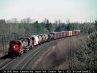 CN 5032 leads a westbound around the bend @ Denfield Road just west of London, Ontario back in April of 1992.