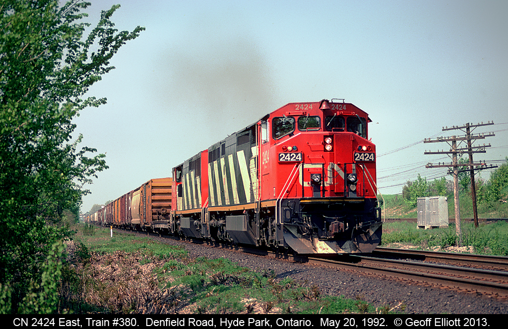 With the CP Windsor Subdivision visible to the right, a pair of C40-8M's, led by 2424, approach Denfield Road bridge back in 1992.  Used to like going here when the area was fairly well groomed and 'open' for shots.  Today it's pretty overgrown from what I've seen, but it's still a cool place to watch trains.