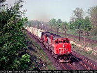 No stacks, no racks, just wells full of trailers as CN 9409 heads up eastbound "Laser" train #392 at Denfield Road back in 1992.  