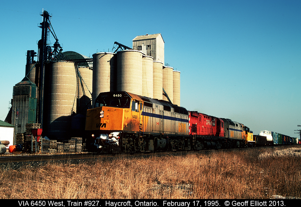 VIA F40PH-2 #6450, and a sister, sandwich a CP C424m on today's train #927 as it passes the mill in Haycroft, Ontario.  Catching a lift home is Essex Terminal #104 which had gone to Toronto the month earlier for some wheel work.  It was normal in the mid-90's to see power from VIA and GO adding horsepower to CP trains on the weekends as CP was so very power short.