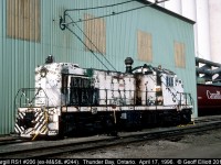 Cargill Alco RS1 #206, ex-Minneapolis and St. Louis #244, sits derelict beside the huge Cargill facility on the south side of Thunder Bay back in 1996.  Sadly this unit was scrapped not long after this.  It was replaced by an ex-CN SW1200RS in yellow.  When I find the pics of it I'll pass them along. 