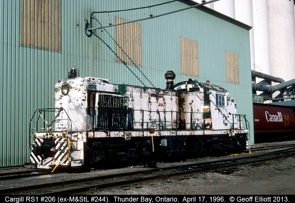 Cargill Alco RS1 #206, ex-Minneapolis and St. Louis #244, sits derelict beside the huge Cargill facility on the south side of Thunder Bay back in 1996.  Sadly this unit was scrapped not long after this.  It was replaced by an ex-CN SW1200RS in yellow.  When I find the pics of it I'll pass them along.