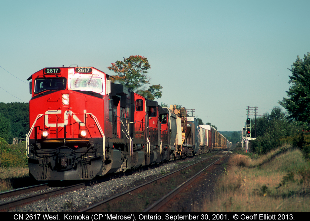CN 2617 leads a long westbound across the CP diamond at 'Melrose' on the Strathroy Subdivision back in 2001.