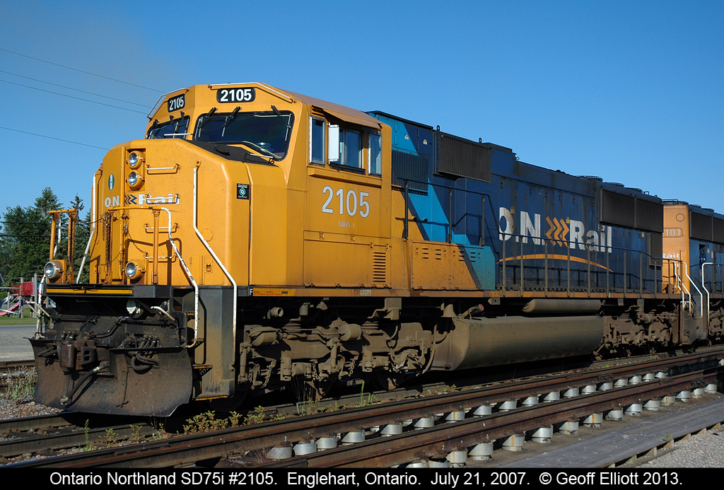On July 21, 2007 Ontario Northland SD75i #2105 sits as the leader for a southbound train waiting to depart Englehart.  2105 will lift the 1735 that I posted earlier for the southbound trip to make a 5 unit consist.  We were lucky as the ONR allowed our motorcar excursion to leave well before the train, giving us an opportunity to see the train heading south much closer to North Bay.