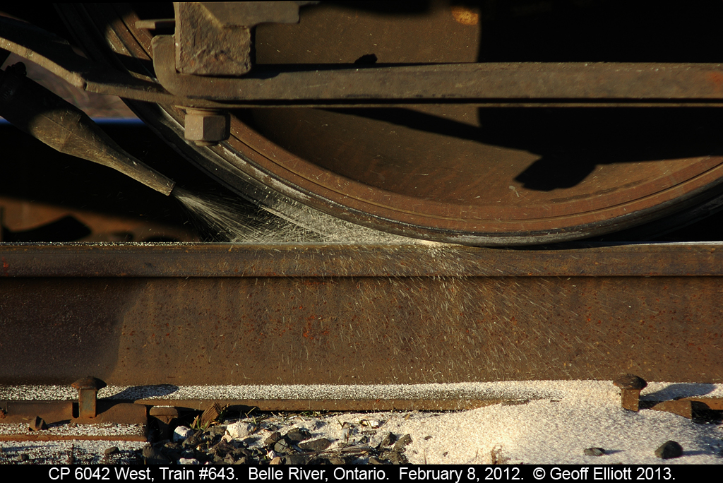 CP SD40-2 #6042 puts the sand to the rail to get train #643 underway after meeting an eastbound in Belle River, Ontario in February 2012.