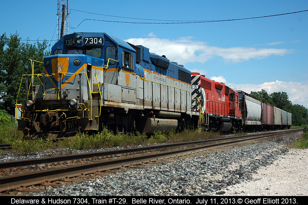 Delaware & Hudson GP38-2 #7304, living on borrowed time in this scheme, heads up train T-29 as it waits in the siding for an eastbound to pass before continuing it's trip back to Windsor.