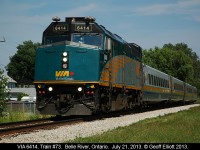 The 40kmph sign in the background certainly does not apply here as VIA 6414 makes track speed as it flies through Belle River, Ontario on July 21, 2013.