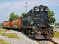 TRRY MLW RS18u #1859 (ex Ottawa Central/New Brunswick East Coast/Canadian Pacific) rounds the bend on the harbour spur of the Port Colborne Harbour Railway to service South Pier Terminals. Nothing will ever beat the chugging of an ALCO engine.