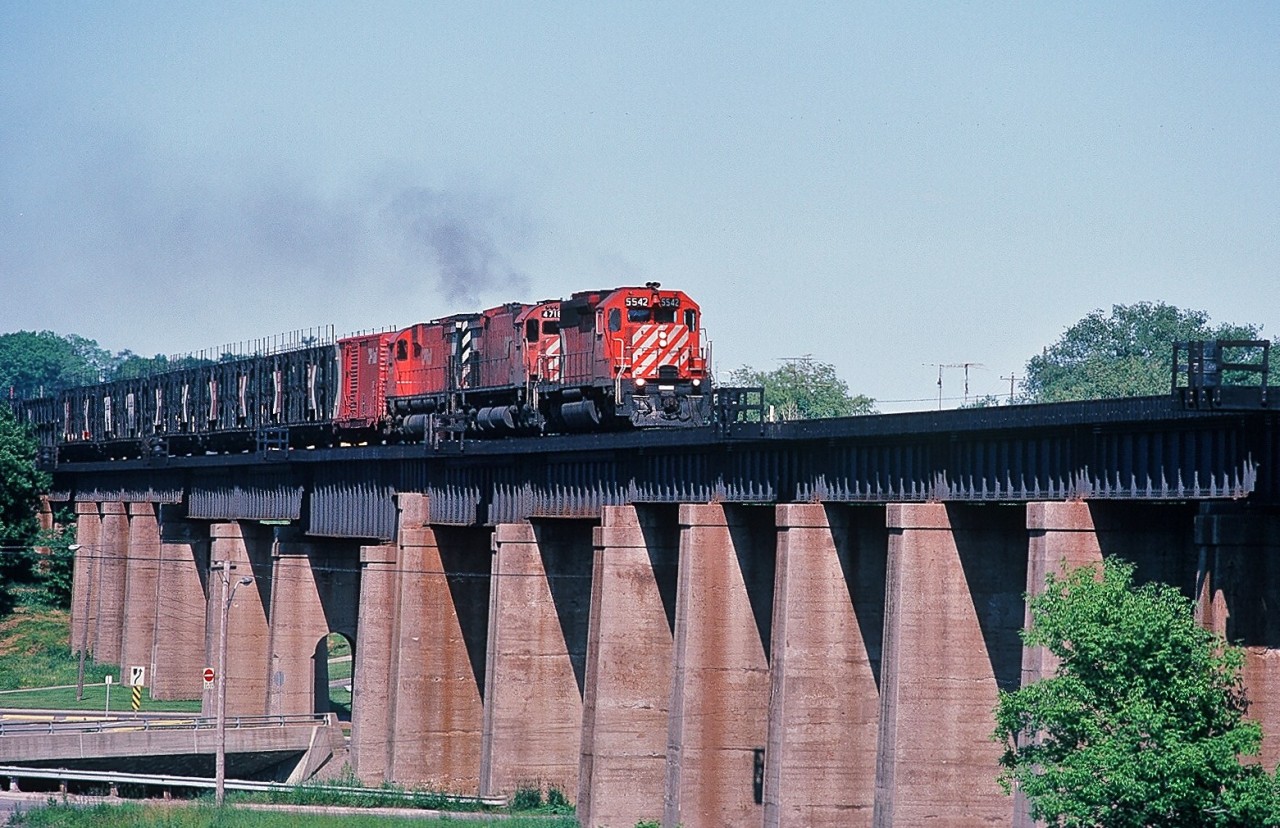 The Multi-Mark Rules !


Long Live the Multi-Mark !


To commemorate the 2013 CARM Convention ( August 9 to 11 ) in Port Hope please enjoy this June 27, 1982 image of a westbound CP Rail on the Ganaraska Viaduct. 


Multi-Mark adorned: CP Rail SD 40 #5542 is assisted by two MLW M 636 #471x and #47xx with a long string of open double deck autoracks destined for the GM plant in Oshawa. ( 5542 sold to National Railway Equipment in 2004).


June 27, 1982 Kodachrome by S. Danko.


More Port Hope:


  CN time at Port Hope   


  VIA at Port Hope