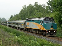 Due to a washout on the Oakville Sub, caused by a record setting rain storm the day before, several VIA trains including the Amtrak Maple Leaf detoured up the Weston and down the Halton Sub to Burlington West, before resuming their normal routing.  Here we see VIA 83 J-trained with VIA 75 splitting the signals at Mile 30, on the Halton Sub.  Typically this location only sees freight traffic, so this was a nice change of pace!
