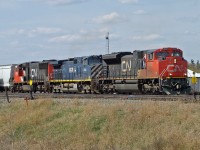Although no longer a division point Wainwright gives its name to the CN Wainwright Sub and trains still frequently stop here. Still sometimes for a crew change, or just for a meet.  This eastbound is stopped.  The power is SD70M-2 CN 8822, DASH 9-44CW BCOL 4648 and SD75I CN 5755.