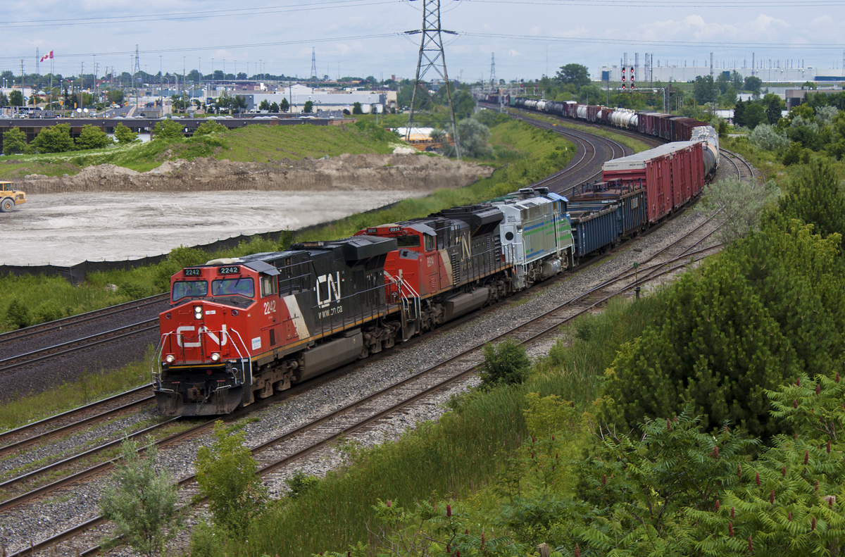 373 departs Oshawa with RBRX 18533 in 3rd position.