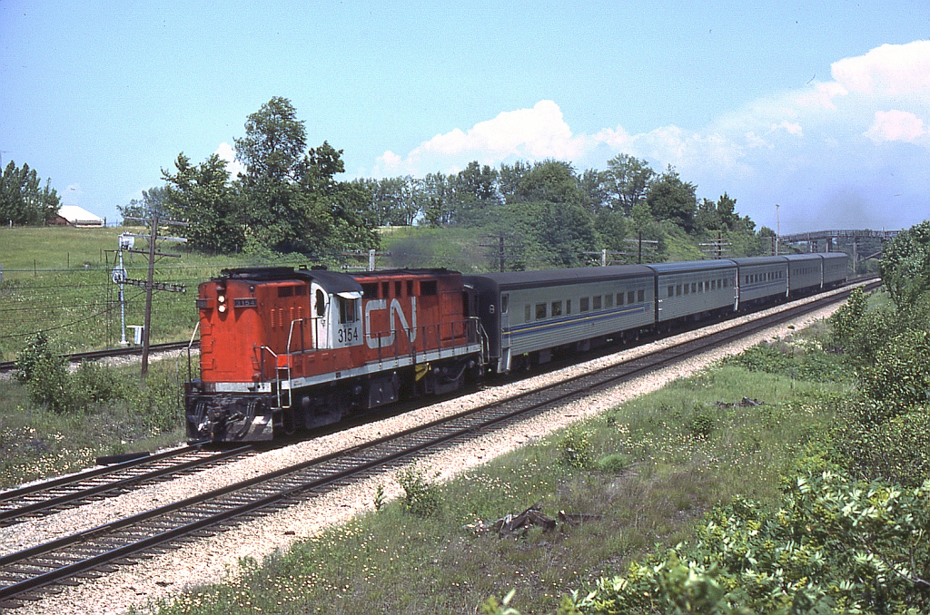 Already on the outskirts of London after making it stop, a CN Tempo with specially modified MLW RS18 3154 heads west through Hyde Park around Mile 6 of the Strathroy Sub.