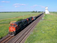 CN 8865 leads a manifest past the elevator at Harte late in the afternoon.