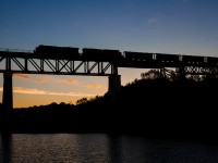 Minutes before sunrise, a northbound Canadian Pacific freight train soars across the Seguin River trestle in the small town of Parry Sound, Ontario creating a nice silhouette. With a few blasts of the horn and a friendly wave from the crew, this was the start to a good day. Visiting the familys' annual mid-July cottage rental in the town of Burks Falls, nearly 70KM SW of Parry Sound, I decided to hit the road at 0445 to try my luck trackside. After making a quick stop at Timmies - with a Large coffee in hand and a perfectly timed northbound, things couldn't have been more satisfying. Thanks goes to RP contributor W.D Shaw for information on railfanning Parry Sound and suggesting this location for an early morning picture!