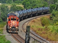 Hammering past Darlington siding with the 120 cars of #643's train, CP 5926 and DME 6201 prove that they still have plenty of life left in them. A fine sight to eyes weary from the horde of GE's. 1551hrs.