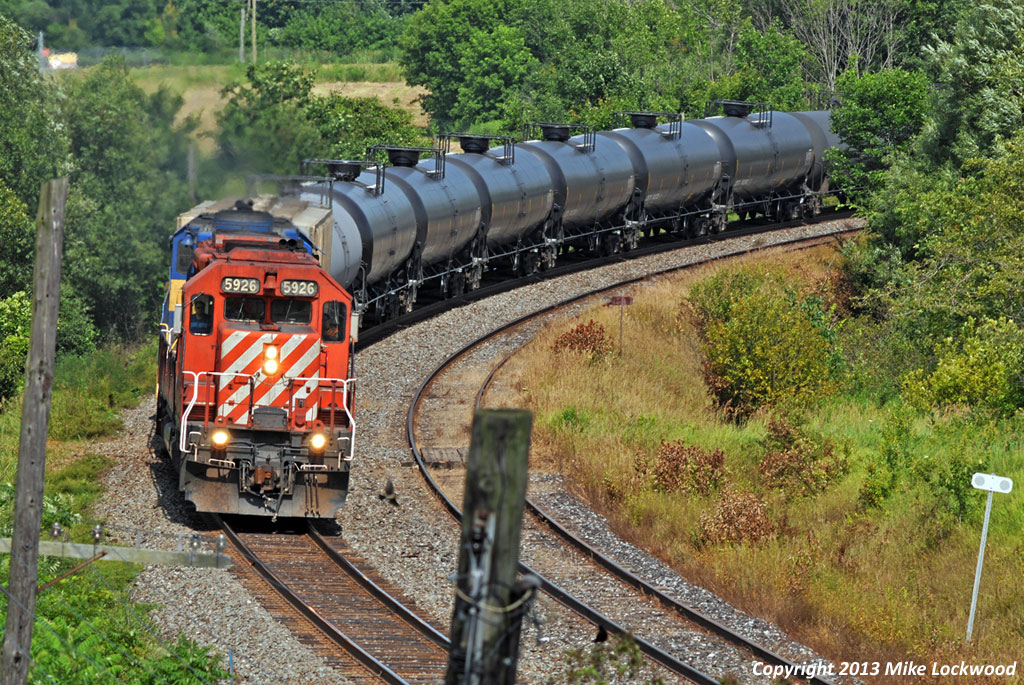 Hammering past Darlington siding with the 123 cars of #643's train, CP 5926 and DME 6201 prove that they still have plenty of life left in them. A fine sight to eyes weary from the horde of GE's. 1551hrs.
