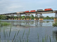 A quartet of SD40's roll empty ethanol tanks west high above the Trent River at Trenton, Ontario. In another life, the third unit was CP 5411, originally QNS&L 215, an SD40 that has found it's way back to familiar rails. Power is, in order of appearance - CP 5926, ICE 6416, DME 6087, CP 5972. 1738hrs.