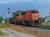 Moving fast under a threatening sky, CP 6024 East, running as GPS2, hit the west end of Colbourne siding. One of the units, CP 5945 is trailing, was having turbo troubles and was loosing power, however it came back to life around Port Hope and they made good time east for a meet with 119 at Brighton, only to act up again east of Trenton. With the number of SD40-2's dwindling, I expect the offending unit may not get repaired and find itself TUSV/TUUS. 1710hrs.