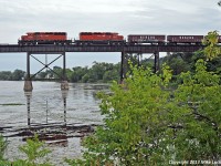 The lankly look of the SD40-2 is evident as CP 6024 and 5945 head out onto the trestle over the Trent River. 1805hrs.