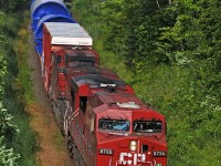 I'd love to green power move this many windmill parts overland. A pair of nasty oil burners haul a westbound special move of snake oil at Wesleyville behind CP 8755 and 9676. At least the crew got a good laugh seeing me standing on the roof of my Element for a little more elevation on the bridge. 1643hrs.