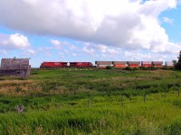 CP's hottest west bound passes the old farm at Esmond.