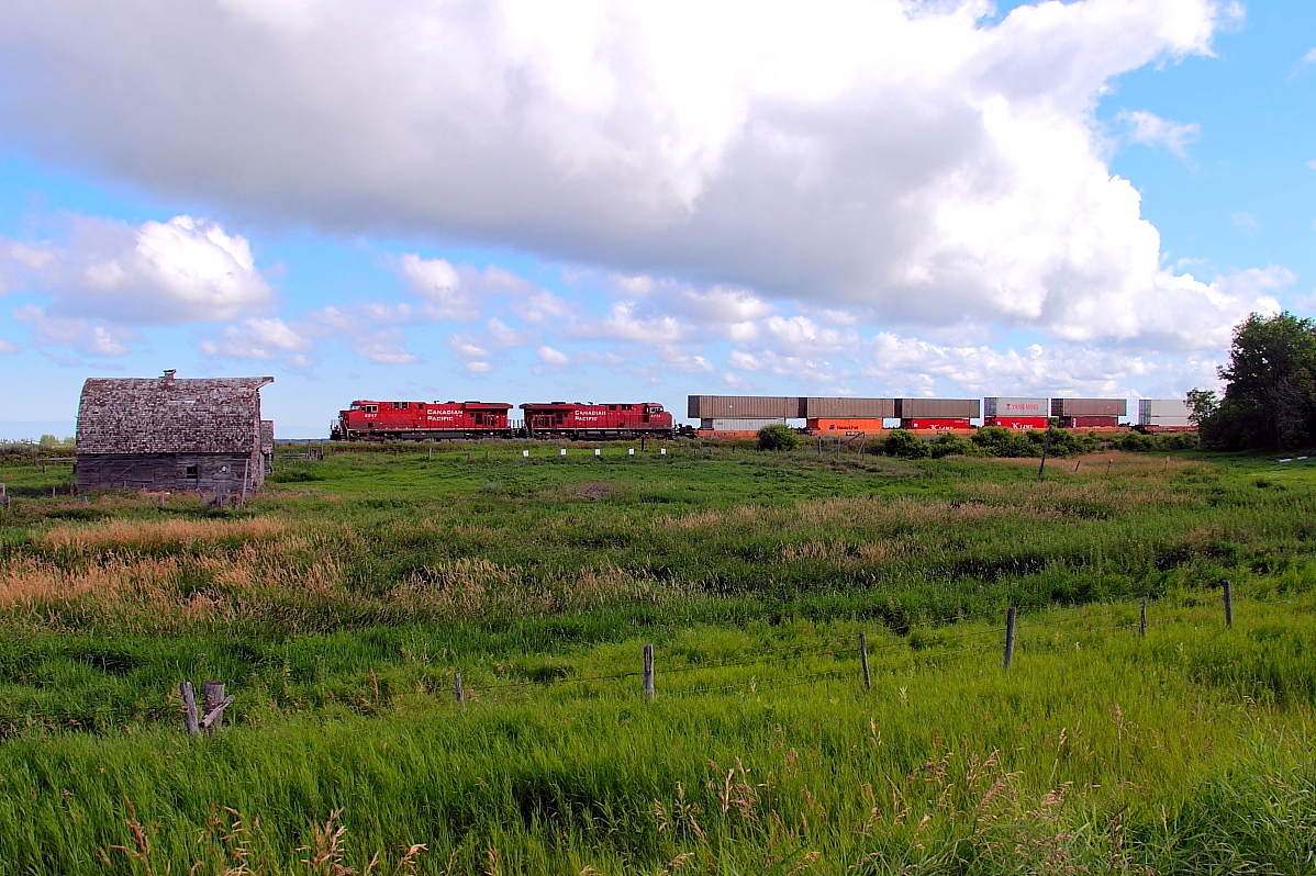 CP's hottest west bound passes the old farm at Esmond.