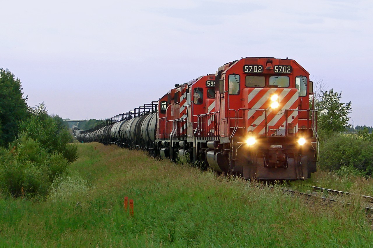 A trio of SD40-2's 5702,5992 and 6005 haul tank cars for the Scotford industrial area.
