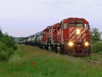 A trio of SD40-2's 5702,5992 and 6005 haul tank cars for the Scotford industrial area.