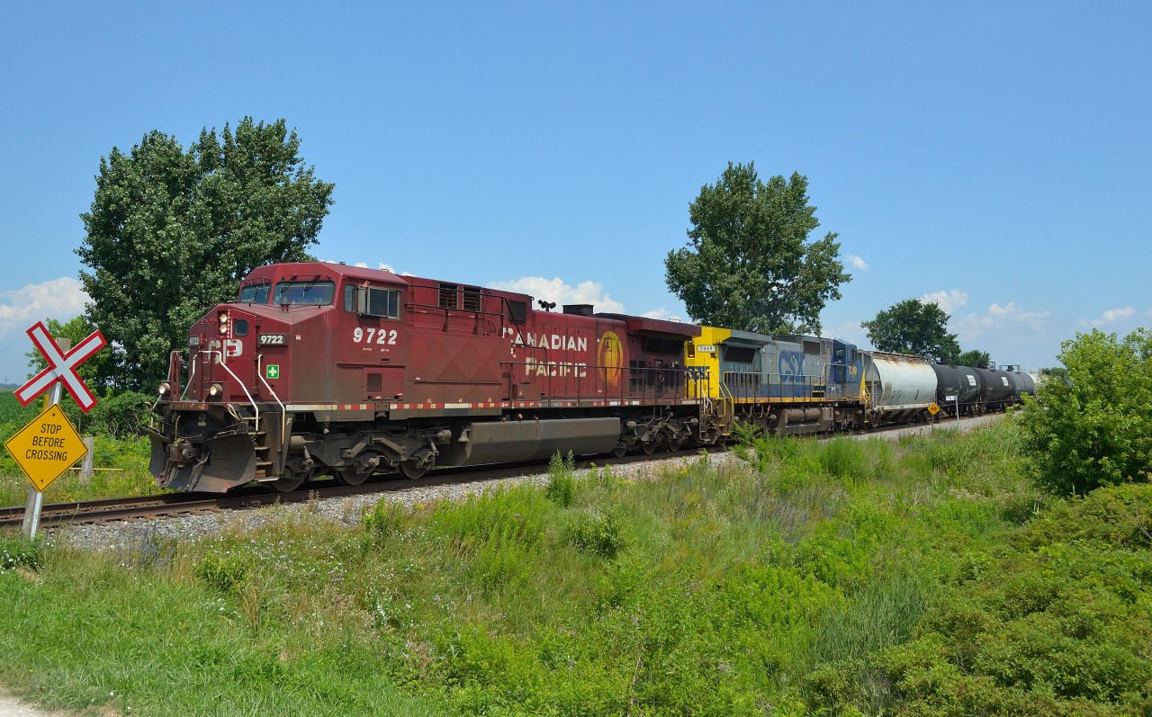 CP 641 heads westbound thru Jeannette mile with some FPON trailing in the consist in the form of CSXT 7349, a Dash 8-40CW