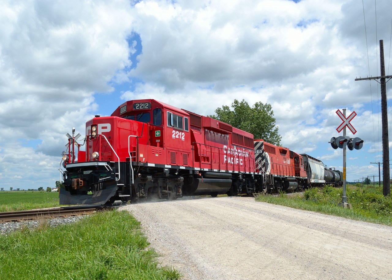 After finishing it's work for the day, CP T29 heads westbound back to Walkerville as it passes thru Tilbury. Leading the way is new GP20C-ECO 2212