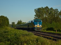 VIA 84 coming from Sarnia, passes the Amiens Road crossing on its approach to the Melrose Diamond.