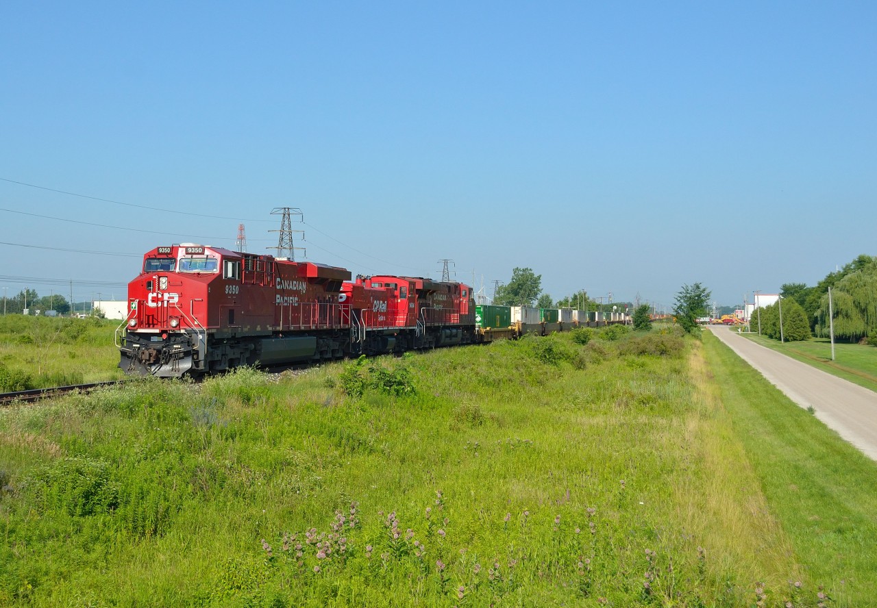 CP 240 heads eastbound thru Tilbury with another MP15 in the consist that is headed for Montreal.