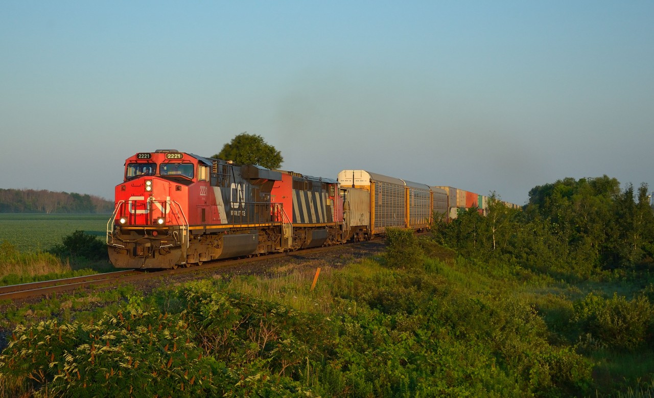 With the sun just coming up, CN 148 heads eastbound out of Sarnia after just clearing CN Mandaumin.