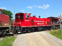 CP 1428, an MP15, trails on CP 240 on its trek to Montreal