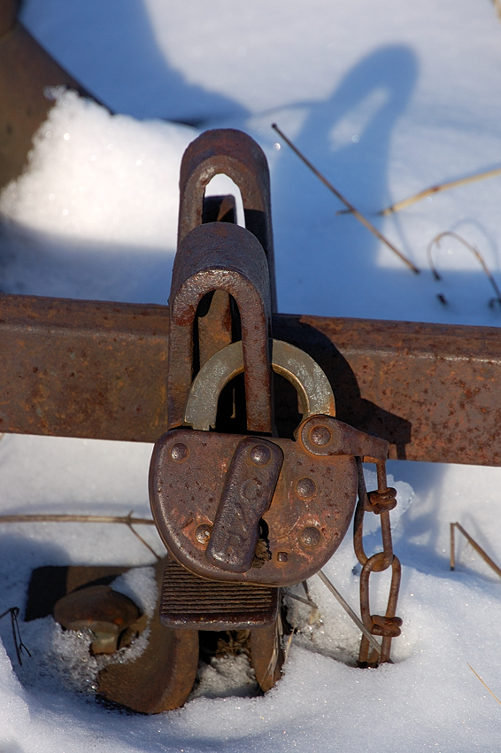 A long shadow is cast on the keeper hold that this rusty CNR switch sits in, just east of BX Tower. Guarding the entrance to the Elgin County Rail Museum off the "mainline" of the CASO, she may have a throw or two left in her to deliver some items to ECRM (namely ex CN F3 9171) before her ultimate removal in May 2010.
