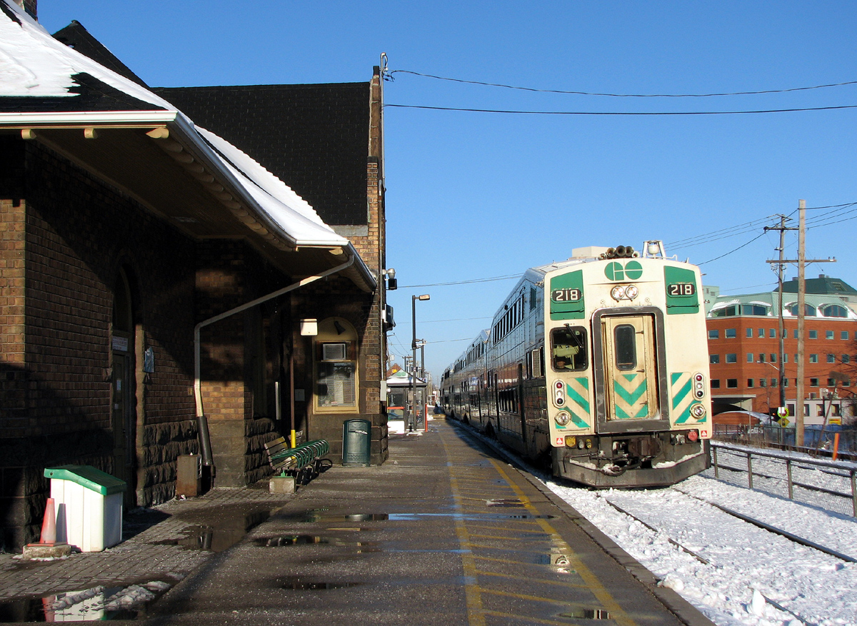 Rolling into the station with a packed train going only as far as Mount Pleasant, GO 218 leads #205, the first rush hour train, into the station at Brampton. Cut short by a derailment at the Credit, today passengers heading for Georgetown will be bussed west from Mount Pleasant Station, and #205 will deadhead back to Toronto, not being able to park for the night at Georgetown.

More information about the incident and the deadhead returning *here*